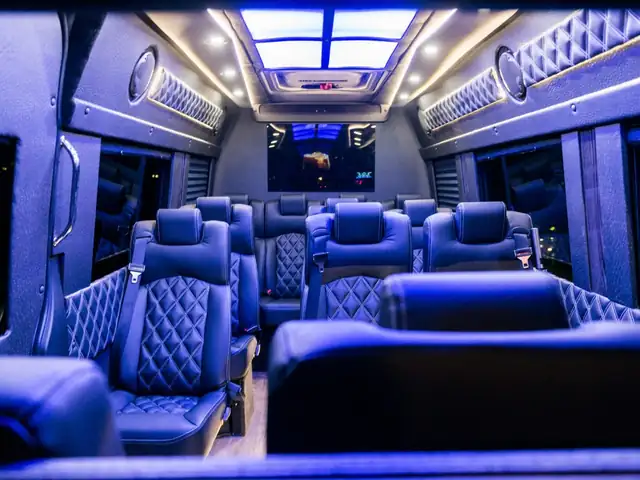 Executive Sprinter interior lit in blue with diamond leather seats, a skylight and quilted side panels — Shuttle Service New Jersey — Mercedes Sprinter