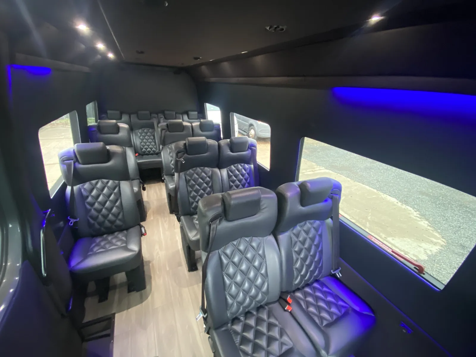 Executive Sprinter with blue accent lighting and diamond leather seats opposite a wide window — Manhattan to Atlantic City, NJ transfers