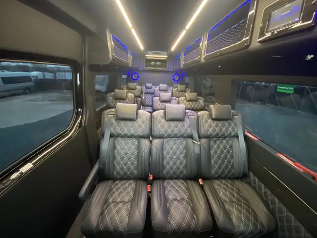 Executive Sprinter rear bench of black quilted leather seats under warm ceiling lights — New Jersey Sprinter service