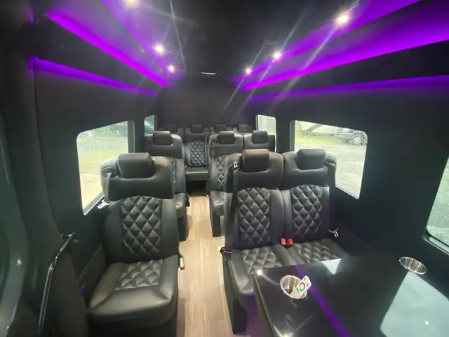 Executive Sprinter cabin with violet LED beams, leather seats and large side windows — Sprinter service in Financial District