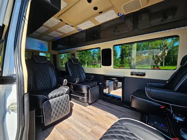 Jet Sprinter with black leather captain chairs, wide side windows and a wood-look floor — LGA airport group transfers