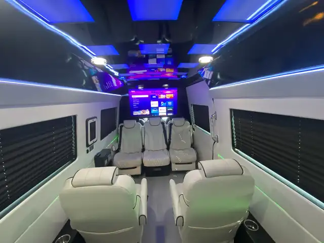 Jet Sprinter with cream leather chairs, window blinds and blue ceiling accent lighting — LGA to Midtown Manhattan transfers