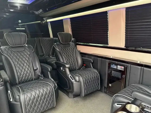 Jet Sprinter with black diamond-quilted captain chairs, white piping and pleated window shades — NYC Sprinter service areas