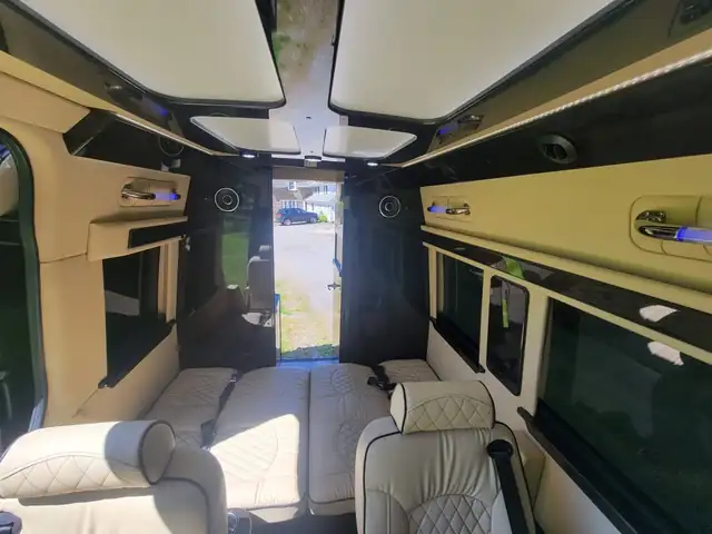 Jet Sprinter with a cream leather bench, wide cream headliner and an open rear door — Special Events