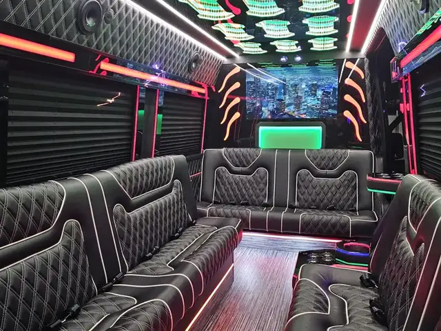 Limo Sprinter with a rainbow-lit ceiling, black sofas trimmed in white and a front TV — Wedding Shuttle Service Long Island — Mercedes Sprinter