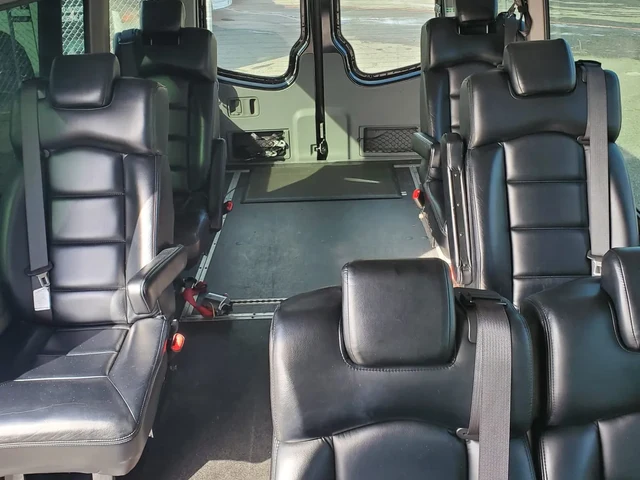 Wheelchair accessible Sprinter with black leather passenger seats, open floor space and wheelchair securement straps — Wheelchair Accessible Van NYC — Mercedes Sprinter