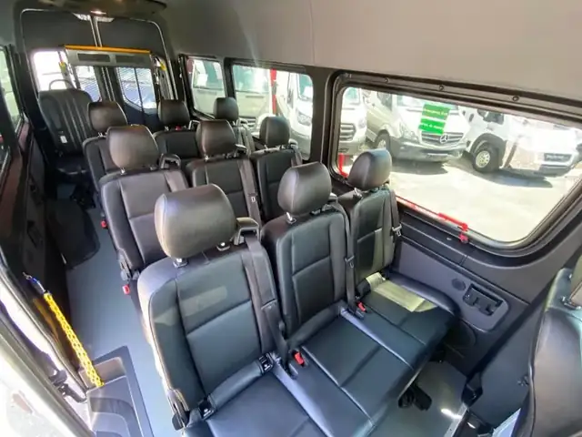Wheelchair accessible Sprinter interior with black leather bench seats, headrests and grab handles, Mercedes Sprinter NYC