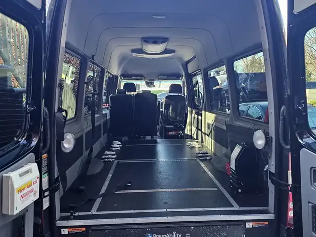 Wheelchair accessible Sprinter open rear doors showing a clear floor and a low step, Mercedes Sprinter NYC